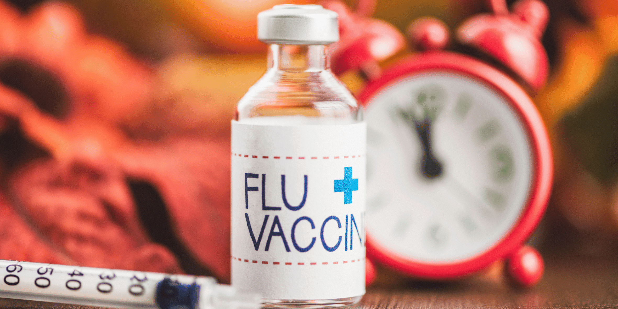 Vial of influenza vaccine with syringe, ready for administration at OUR GP Dundee